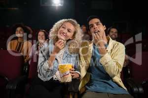 Couple watching movie in theatre