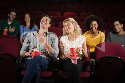 Couple watching movie in theatre