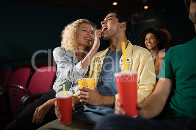 Couple watching movie in theatre