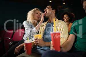 Couple watching movie in theatre