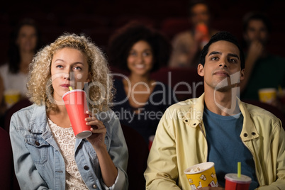 Couple watching movie in theatre