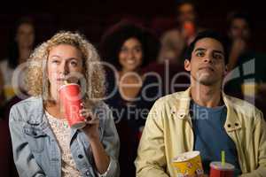 Couple watching movie in theatre