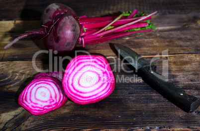 Fresh red beet on a brown wooden background