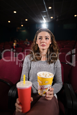 Woman watching movie in theatre