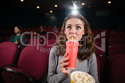 Woman watching movie in theatre