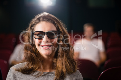 Woman watching movie in theatre