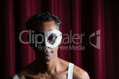 Man wearing masquerade mask