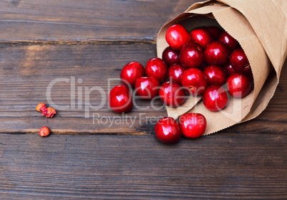 Red cherry in a paper bag