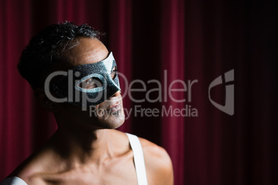 Man wearing masquerade mask