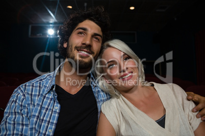 Couple watching movie in theatre