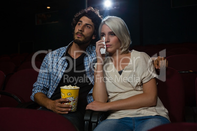 Couple getting emotional while watching movie
