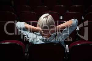 Woman watching movie in theatre