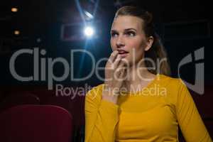 Woman watching movie in theatre