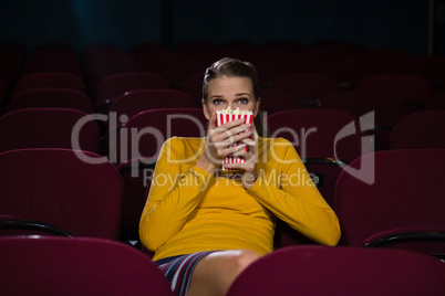 Woman scared while watching movie
