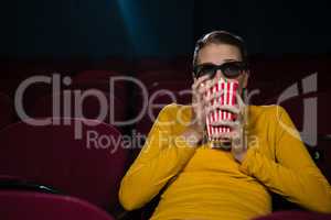 Woman scared while watching movie