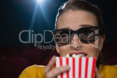 Woman scared while watching movie