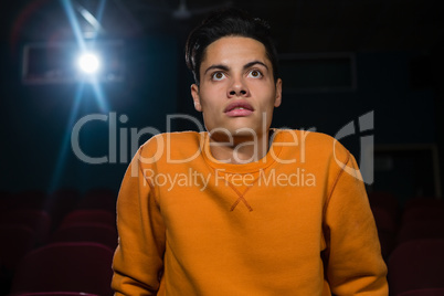 Man with shocked expression looking at the movie