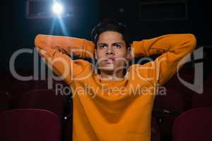 Man watching movie in theatre