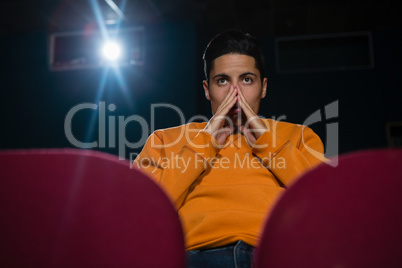Man watching movie in theatre