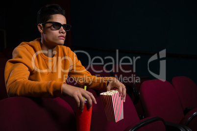 Man in 3d glasses watching movie