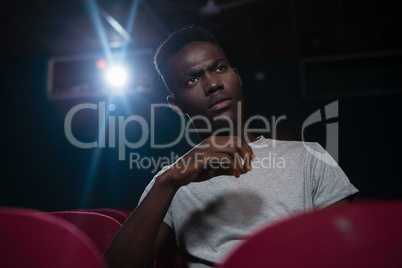 Man watching movie in theatre