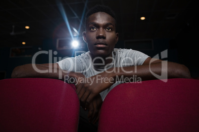 Man watching movie in theatre