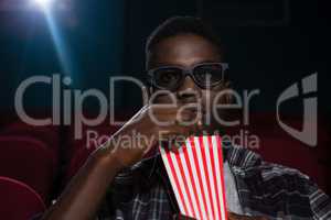 Man having popcorn while watching movie