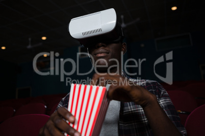 Man using virtual reality headset while watching movie