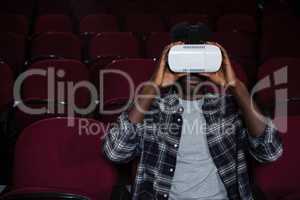 Man using virtual reality headset while watching movie