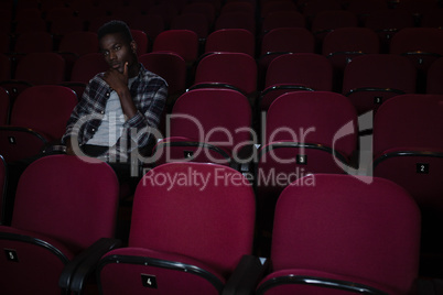 Man watching movie in theatre
