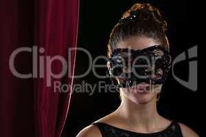 Woman wearing masquerade mask