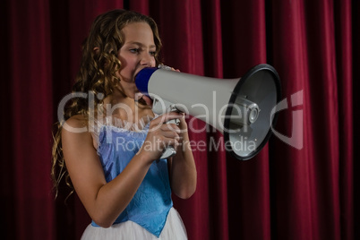 Female artist announcing on megaphone