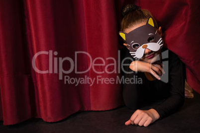 Ballet dancer wearing mask gesturing