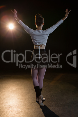 Ballerina practicing ballet dance on the stage