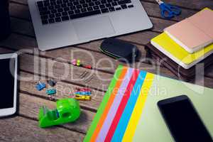 High angle view of laptop and digital tablet with office supplies