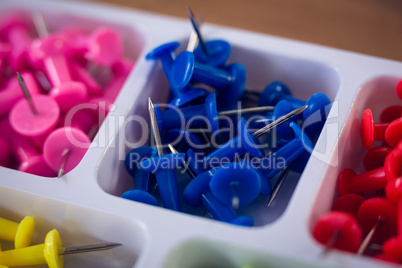 High angle view of colorful paper pins