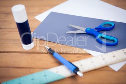 Close up of scissor on papers with school supplies