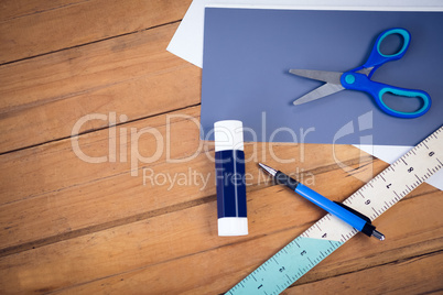 Directly above shot of scissor on papers with school supplies