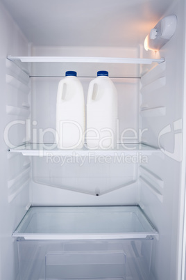 Milk bottles in refrigerator