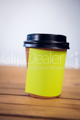 Close up of adhesive note stuck on disposable cup