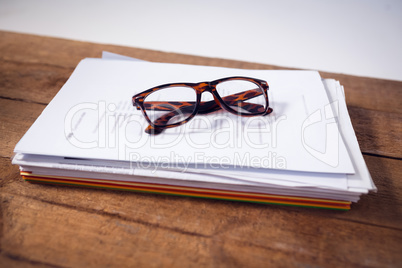 Close up of eyeglasses on documents