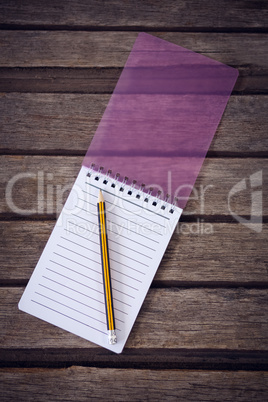 Overhead view of pencil with notepad