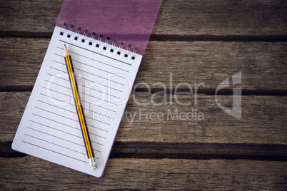 Close up of pencil with notepad