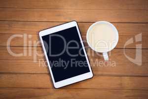 Directly above shot of digital tablet with coffee cup
