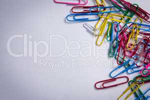 Various paper clips on white background