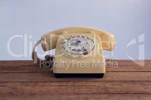 Vintage phone on wooden table
