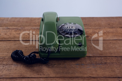 Vintage phone on wooden table