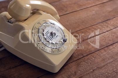 Vintage phone on wooden table