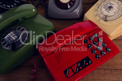 Modern and vintage phone on wooden table