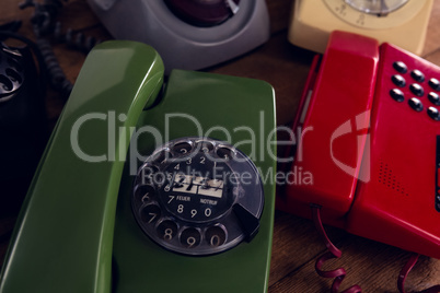 Modern and vintage phone on wooden table